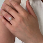 oval diamond engagement ring with pave diamonds in the band