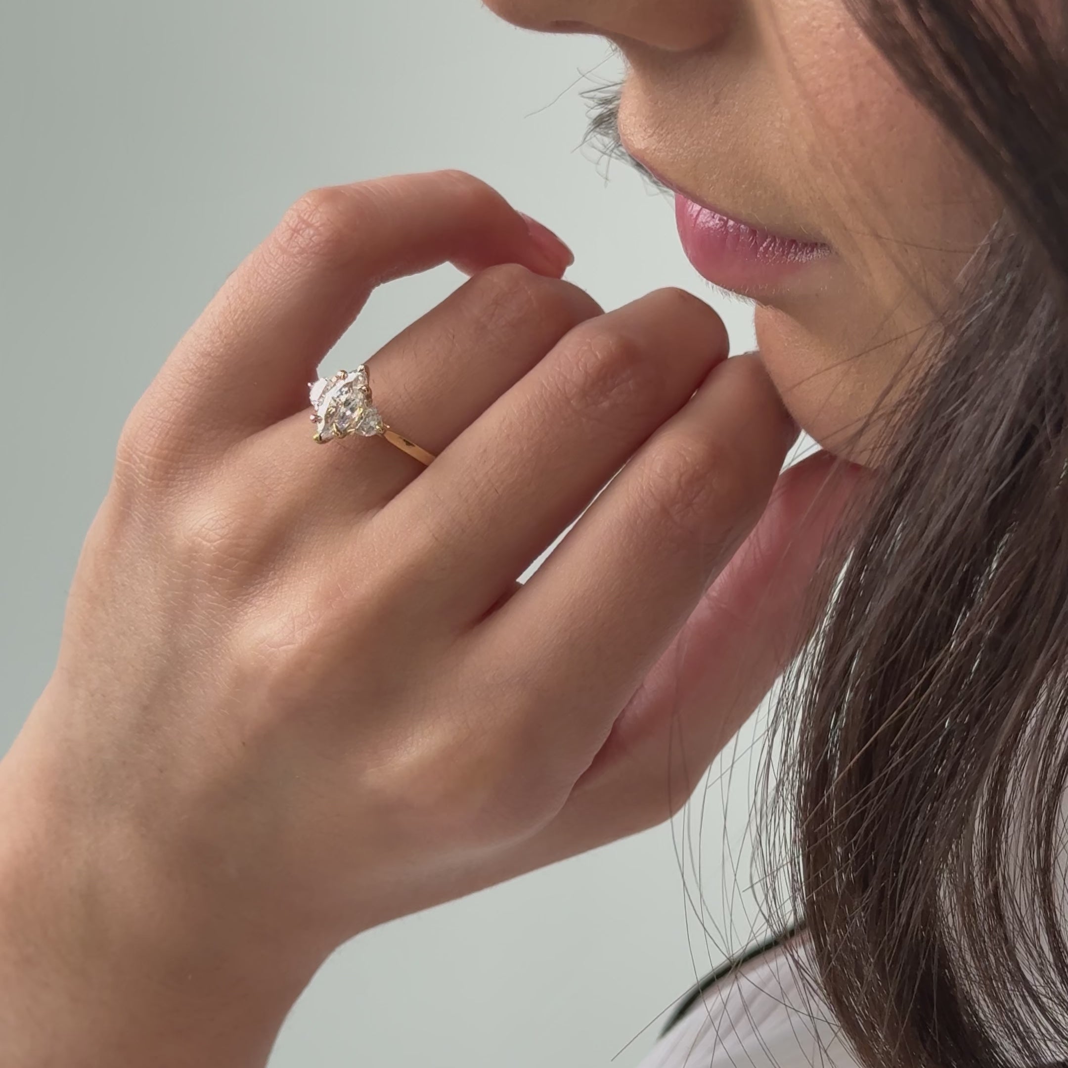 Trilogy engagement ring with marquise cut diamond centre
