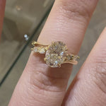 Oval Cut diamond engagement ring with marquise cut accent stones