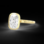 Elongated Cushion Cut diamond bezel set engagement ring 