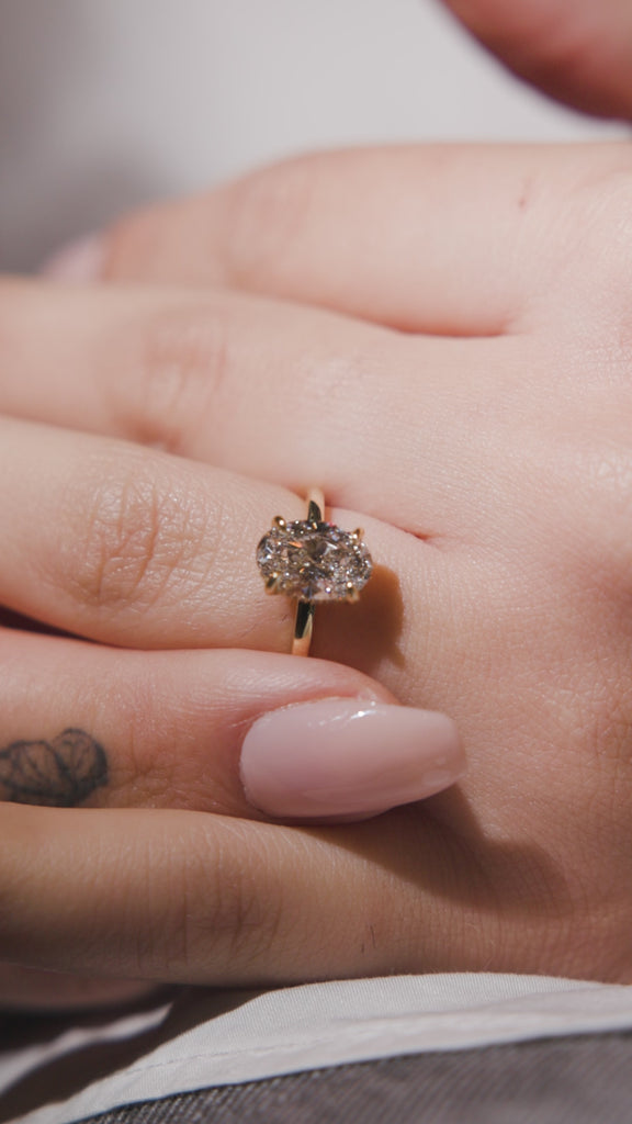 oval with hidden halo engagement ring 