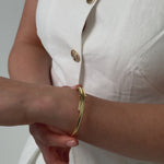 gold plated crossover bangle