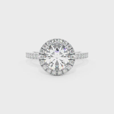 round brilliant cut diamond ring with diamond halo in platinum