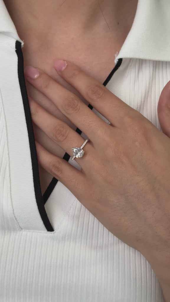 pear cut diamond ring with pave diamond band