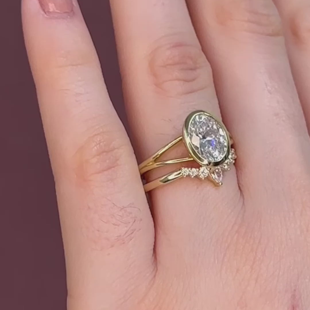 bezel set oval engagement ring in yellow gold