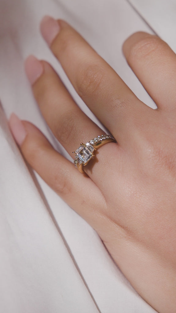 EMERALD CUT THREE STONE ENGAGEMENT RING