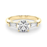 three stone trilogy engagement ring with round moissanite and tapered baguette side moissanites