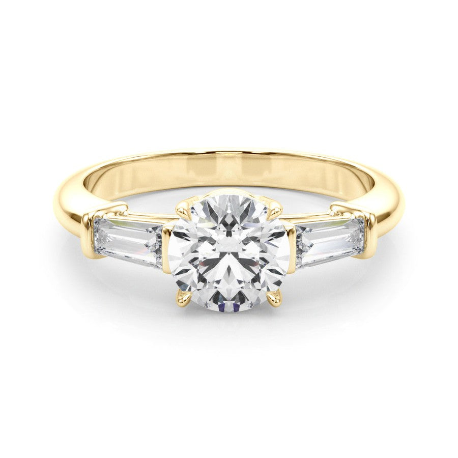 three stone trilogy engagement ring with round moissanite and tapered baguette side moissanites