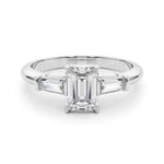Three stone engagement ring with emerald cut centre and side stones