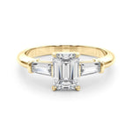 Three stone engagement ring with emerald cut centre and side stones
