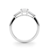 Three stone engagement ring with emerald cut centre and side stones