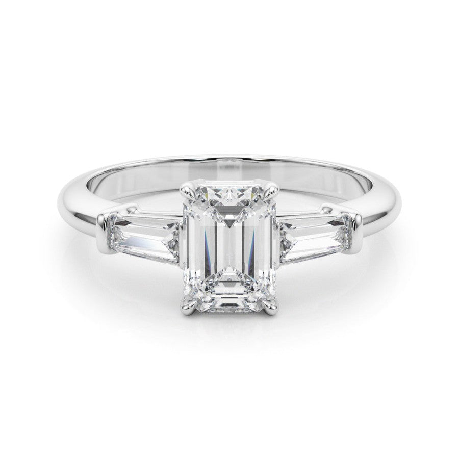 three stone engagement ring with moissanite emerald cut moissanite centre stone and baguette cut moissanite side stones 