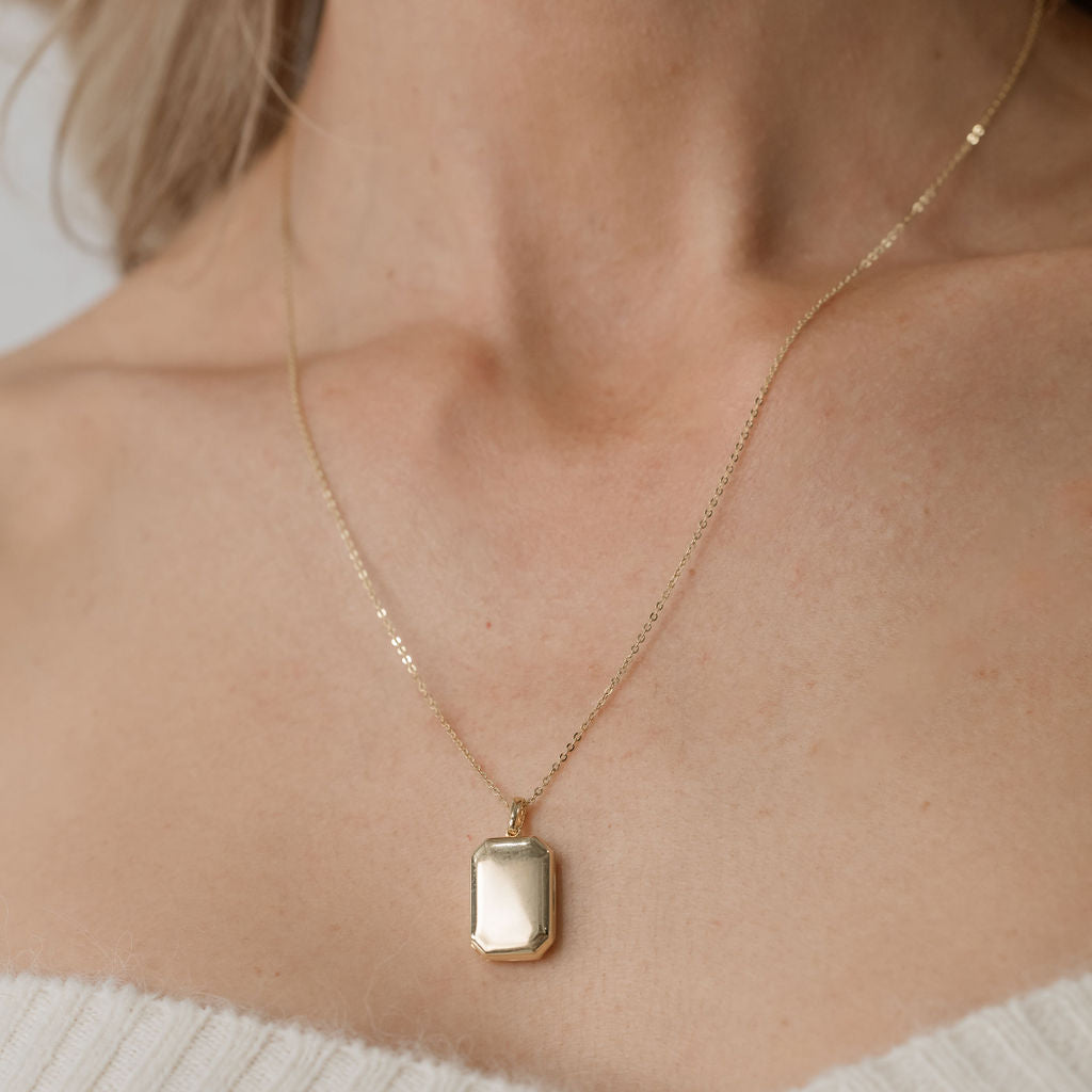 rectangular bevel locket on plain chain yellow gold 