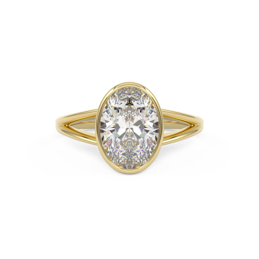 Bezel Set oval engagement with a split shank in yellow gold