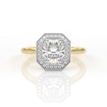 Elongated cushion cut engagement ring with a halo and millgrain detail