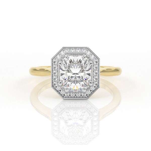 Elongated cushion cut engagement ring with a halo and millgrain detail