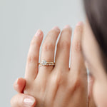 round diamond and marquise diamond wedding ring with round brilliant solitaire engagement ring