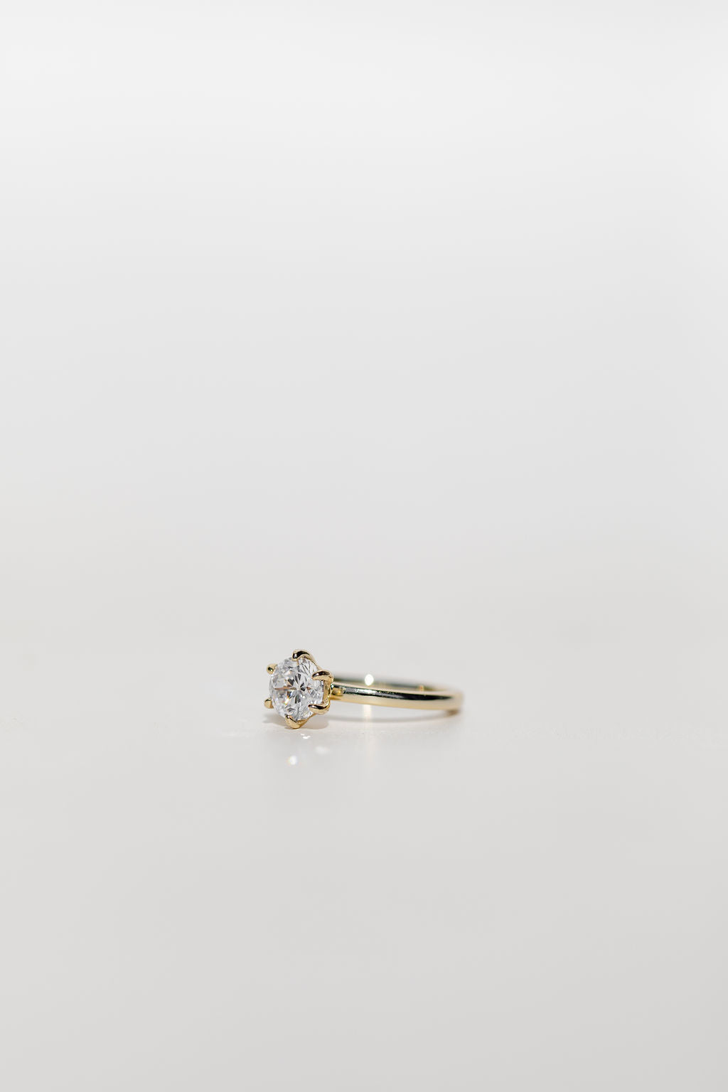 six claw round brilliant cut diamond solitaire engagement ring