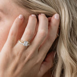 Statement diamond wedding ring with princess cut and baguette cut diamonds with an emerald cut solitaire engagement ring
