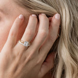 Statement diamond wedding ring with princess cut and baguette cut diamonds with an emerald cut solitaire engagement ring