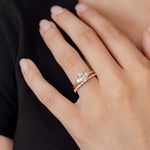 three stone engagement ring with oval centre and diamond wedding ring