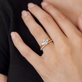 three stone engagement ring with oval centre and diamond wedding ring