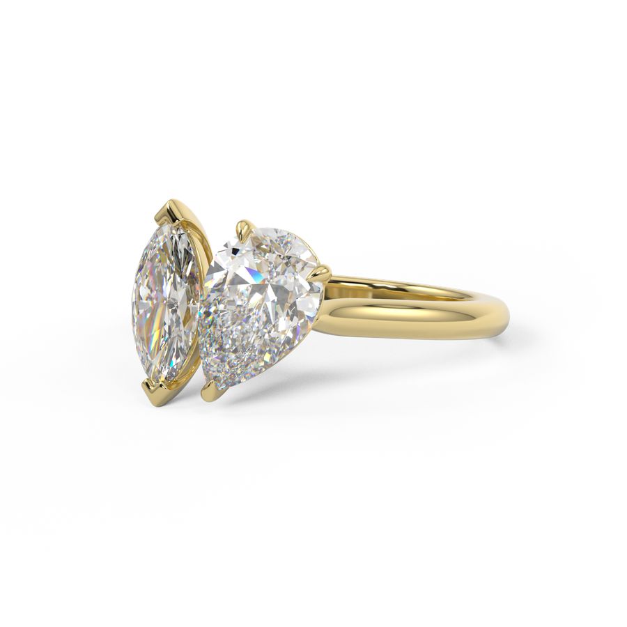 toi et moi engagement ring with pear and marquise shape diamond in yellow gold