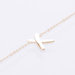 x bracelet 9ct yellow gold