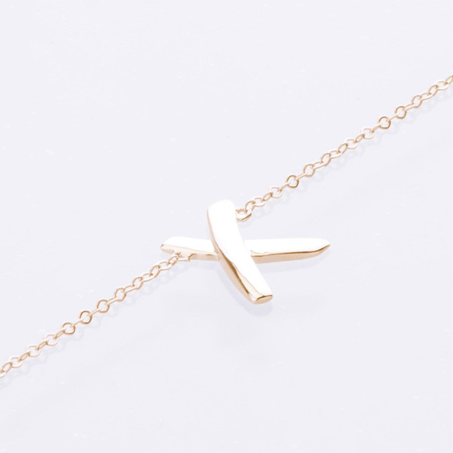 x bracelet 9ct yellow gold