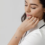 x bracelet signet ring and stacking rings