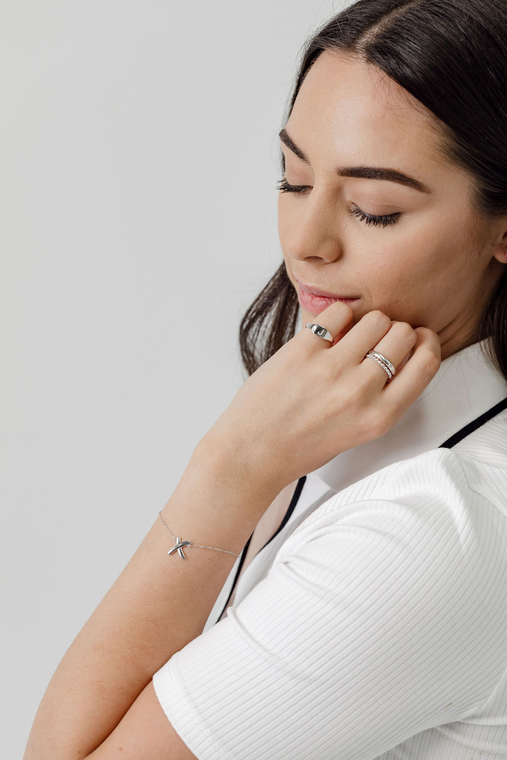 x bracelet signet ring and stacking rings