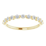 yellow gold diamond wedding ring with single claws and round diamonds