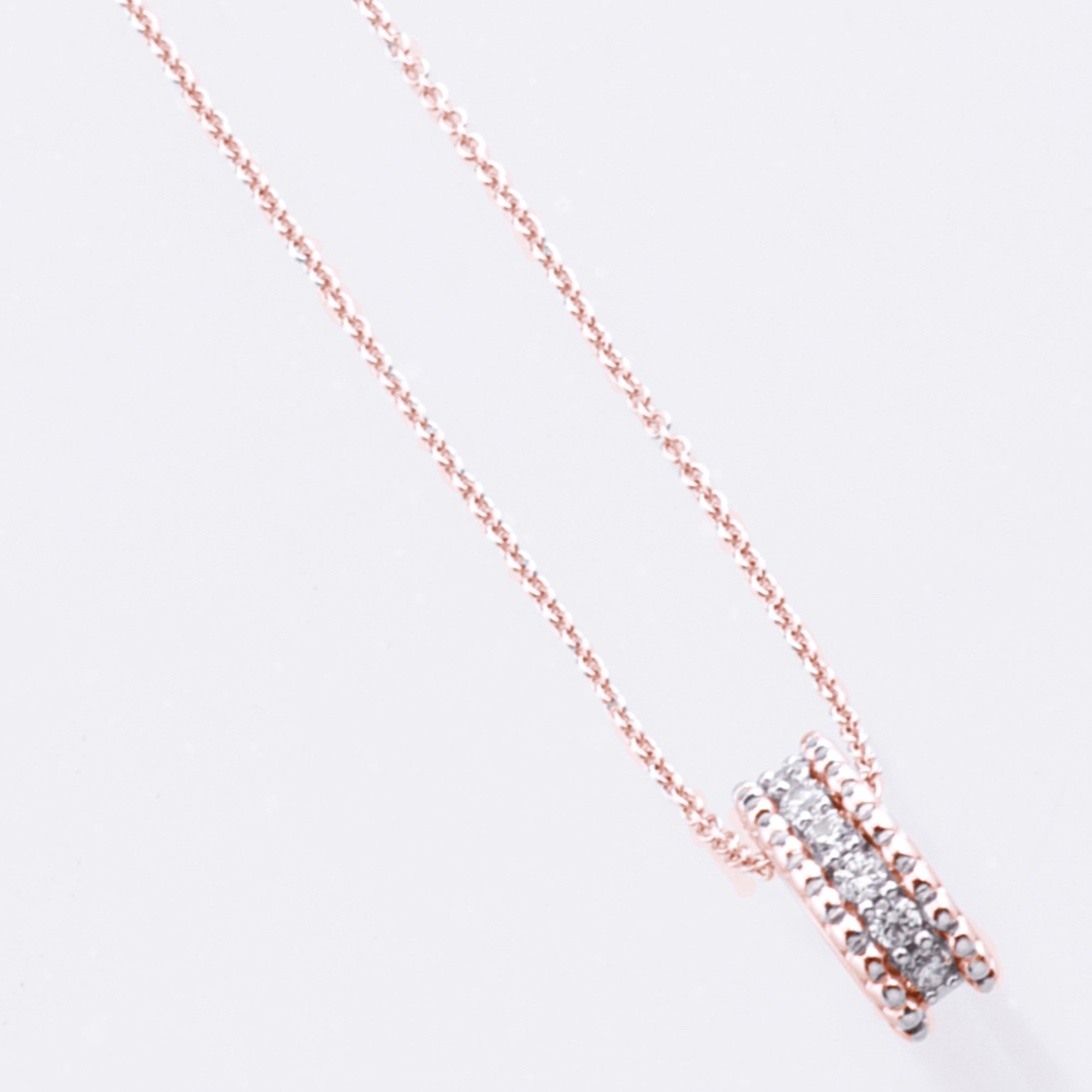 rose gold sparkly cylinder pendant and necklace